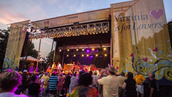 Image Showing Cheerful Audience enjoying the musical concert